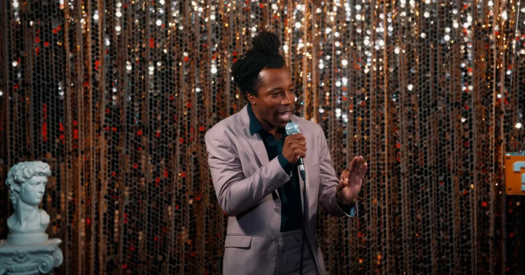 Chad Chambers hosting a corporate event on stage with a microphone