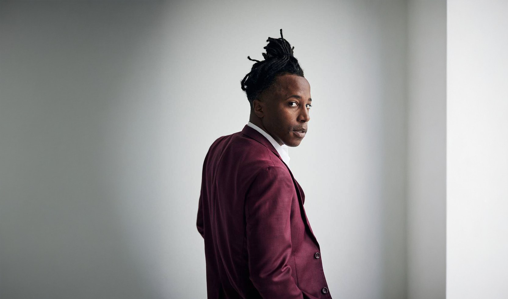 Portrait of comedian and event emcee Chad Chambers in a burgundy suit
